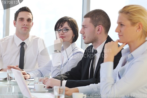 Image of group of business people at meeting