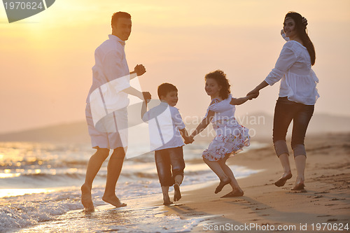 Image of happy young family have fun on beach