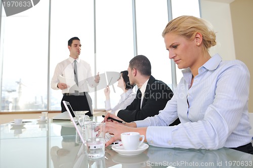 Image of group of business people at meeting