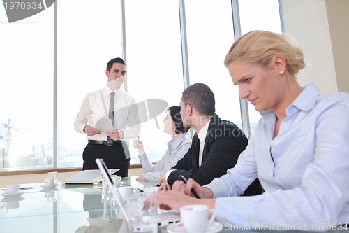 Image of group of business people at meeting