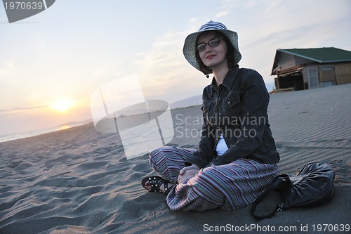 Image of young woman enjoy on beach