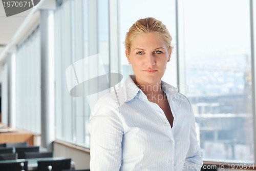 Image of young business woman on meeting