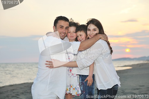 Image of happy young family have fun on beach