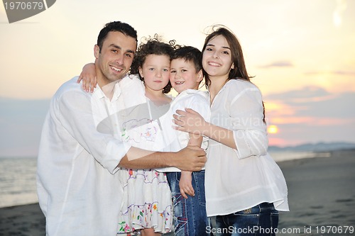 Image of happy young family have fun on beach