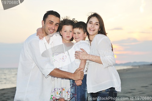 Image of happy young family have fun on beach