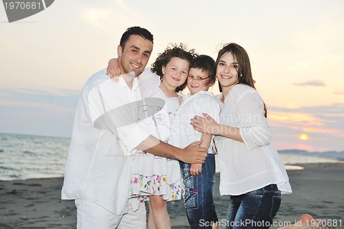 Image of happy young family have fun on beach
