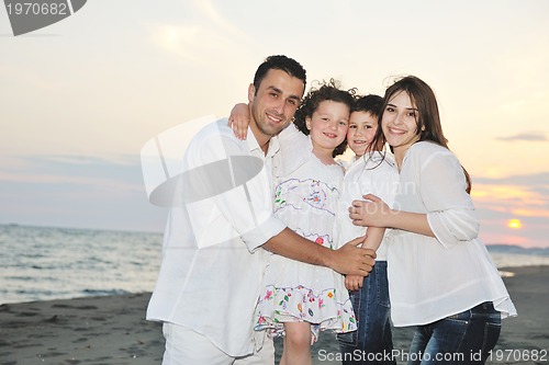 Image of happy young family have fun on beach