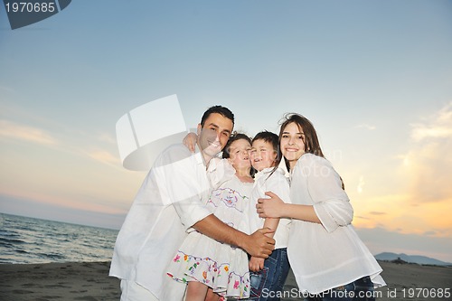 Image of happy young family have fun on beach