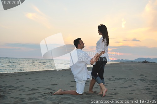 Image of happy young couple have fun on beach
