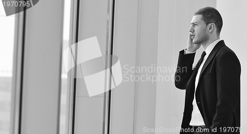Image of young business man talk by cellphone
