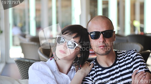 Image of happy young couple have fun on beach