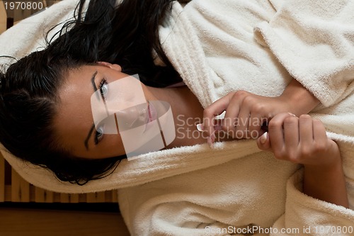 Image of Young woman take a steam bath