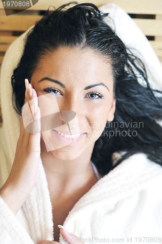 Image of Young woman take a steam bath