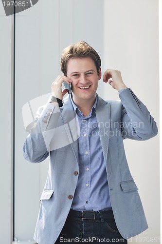 Image of young business man talk by cellphone