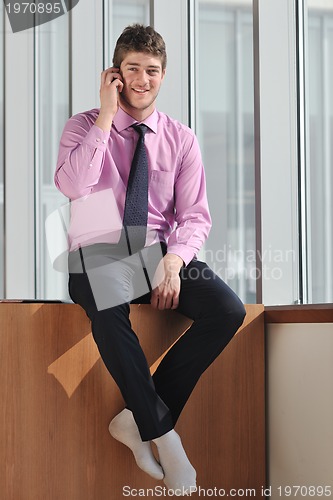 Image of young business man talk by cellphone