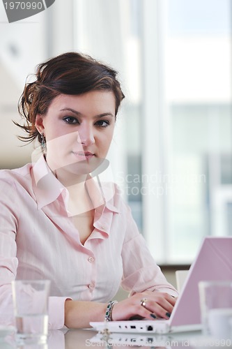 Image of young business woman on meeting
