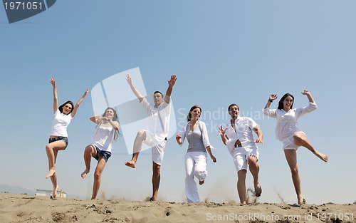 Image of happy young  people group have fun on beach