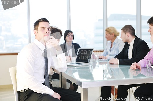 Image of group of business people at meeting