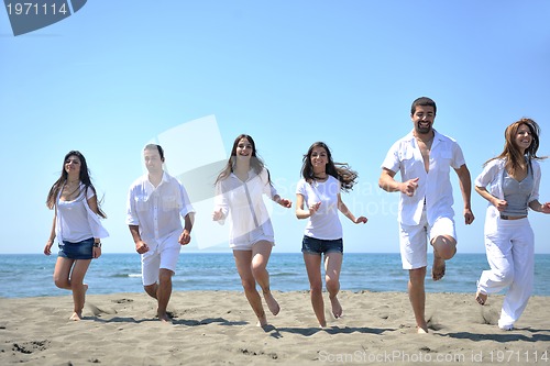 Image of happy young  people group have fun on beach