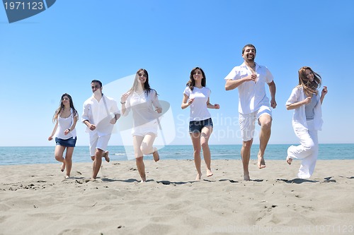 Image of happy young  people group have fun on beach