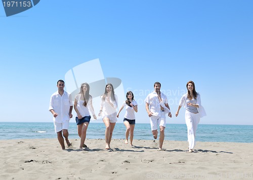 Image of happy young  people group have fun on beach