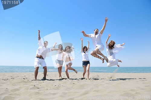 Image of happy young  people group have fun on beach
