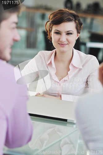 Image of young business woman on meeting