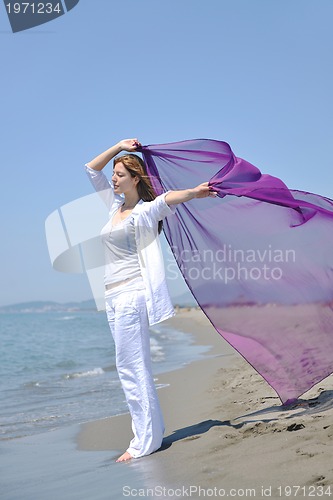 Image of young woman relax  on beach