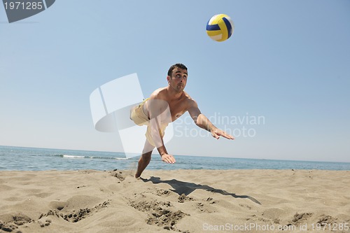 Image of male beach volleyball game player