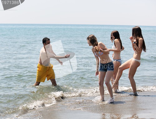 Image of happy young  people group have fun on beach