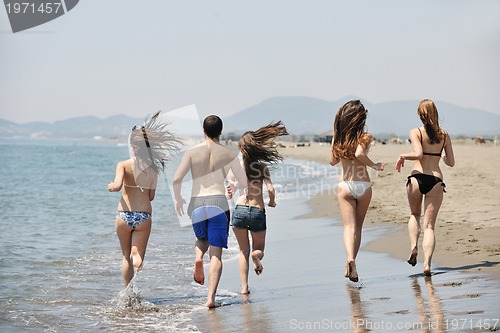 Image of happy young  people group have fun on beach