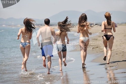 Image of happy young  people group have fun on beach