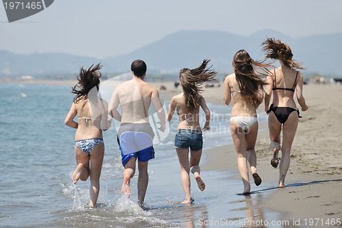 Image of happy young  people group have fun on beach