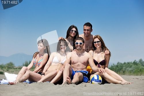 Image of happy young  people group have fun on beach