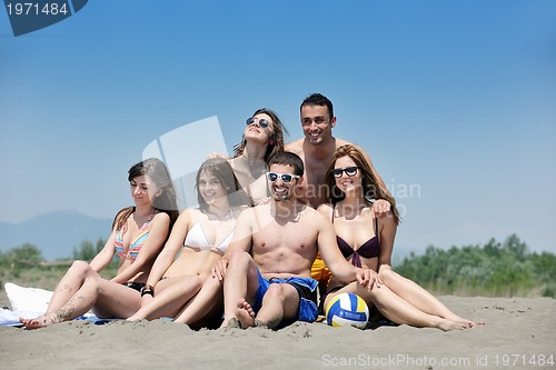 Image of happy young  people group have fun on beach