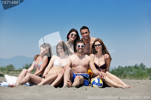 Image of happy young  people group have fun on beach