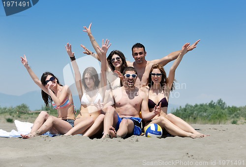Image of happy young  people group have fun on beach