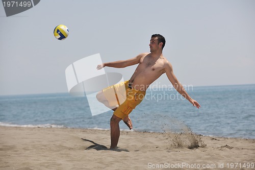 Image of male beach volleyball game player