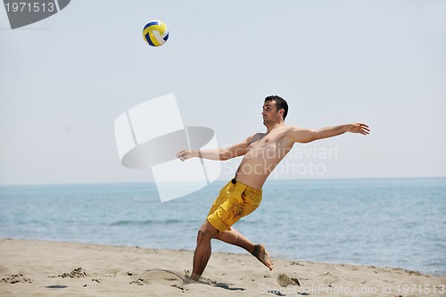 Image of male beach volleyball game player