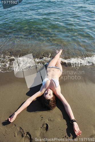 Image of young woman relax  on beach