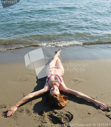 Image of young woman relax  on beach