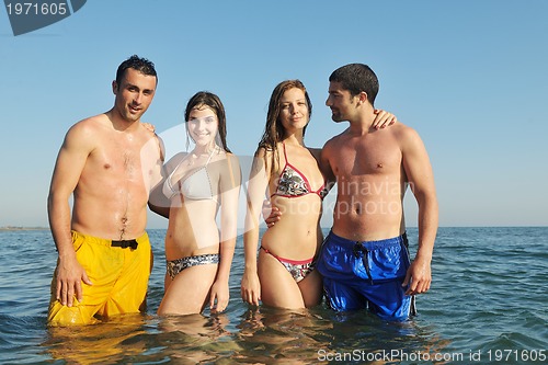 Image of happy young  people group have fun on beach