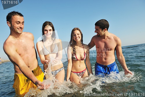Image of happy young  people group have fun on beach