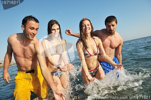 Image of happy young  people group have fun on beach