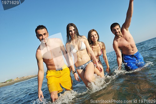 Image of happy young  people group have fun on beach