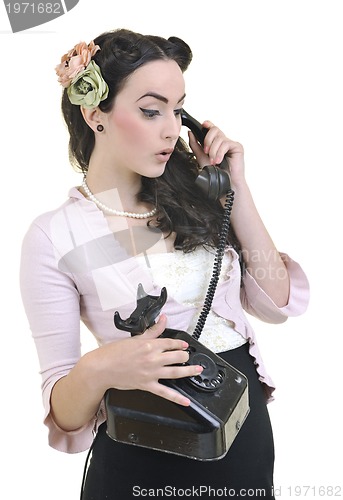 Image of pretty girl talking on old phone