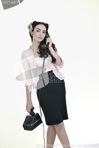 Image of pretty girl talking on old phone