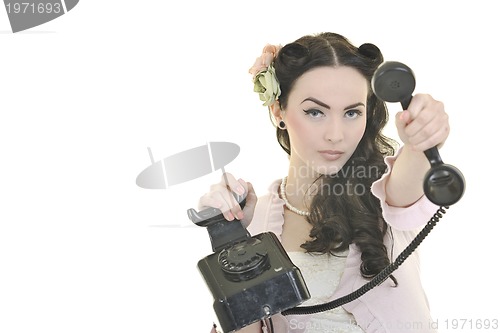 Image of pretty girl talking on old phone