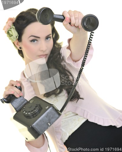 Image of pretty girl talking on old phone