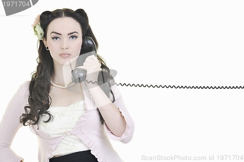 Image of pretty girl talking on old phone